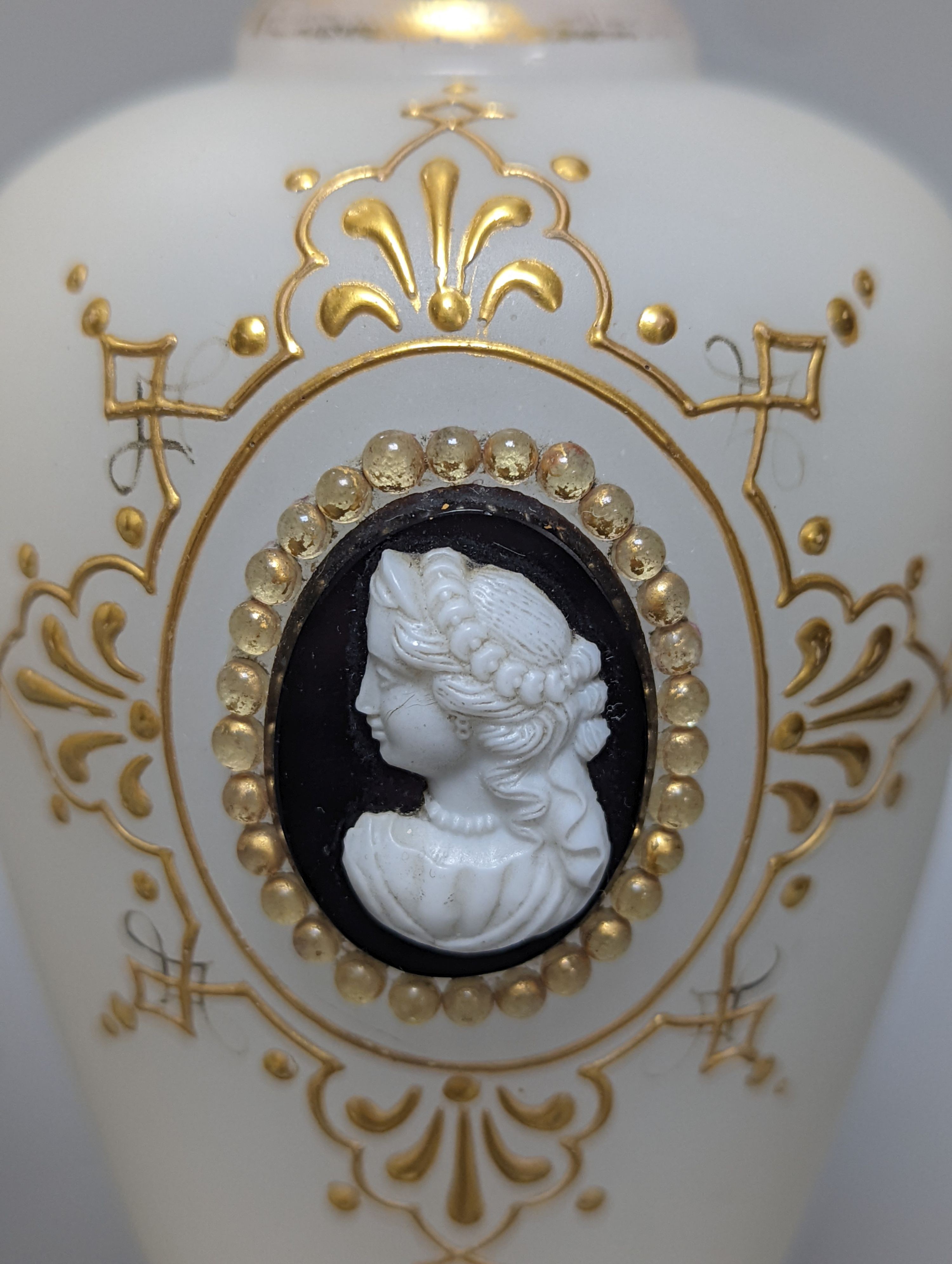 Two cameo and gilt decorated vases, 23 cms high.